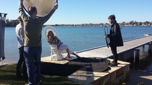 A cover try on the jetty and a white cane chair as a prop